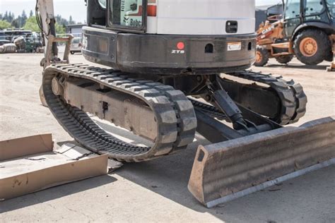 how to put track back on bobcat mini excavator|mini excavators working videos.